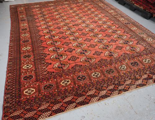 fig 1. ANTIQUE TEKKE TURKMEN MAIN CARPET IN A SOFT WARM PINK / RED COLOUR, CIRCA 1900.