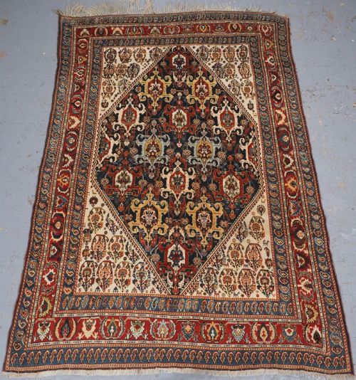 Antique Qashqai Kashkuli Rug with Repeat Medallion Design, Circa 1900.