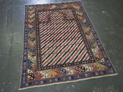 fig 1. ANTIQUE CAUCASIAN SHIRVAN OR DAGESTAN PRAYER RUG OF SCARCE DIAGONAL STRIPE DESIGN, CIRCA 1850.