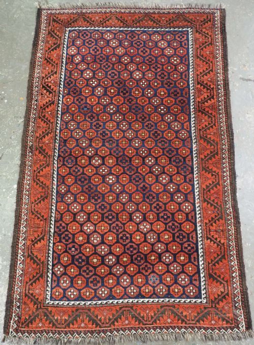 ANTIQUE BALUCH RUG WITH SCARCE REPEAT SMALL OCTAGON DESIGN CIRCA 1900