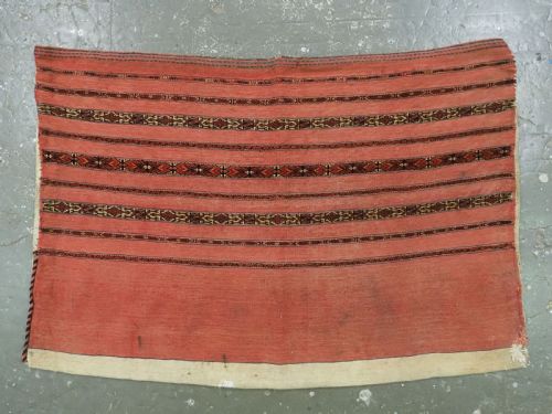 fig 2. A pair of antique Tekke Turkmen woven wool Kizil cuval bags featuring horizontal red and patterned geometric stripes with cream selvedges.