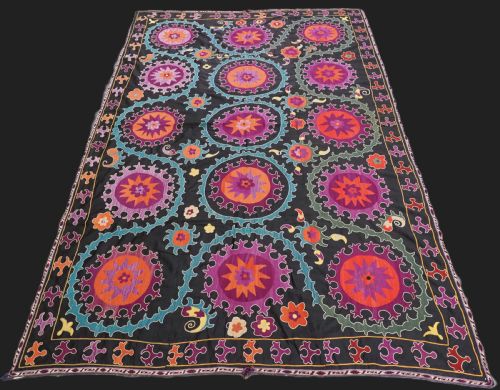 Antique Uzbek Suzani, Silk on a Black Cotton Ground, Circa 1900.