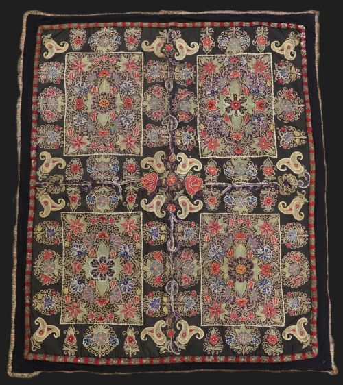 fig 1. An antique Persian Rasht textile featuring silk floral and boteh embroidery on a black wool felt ground.