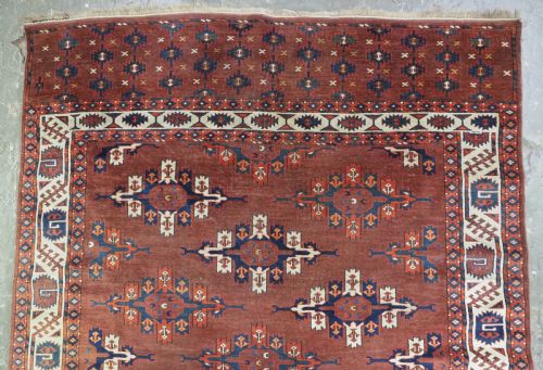 fig 1. ANTIQUE KARADASAHLI YOMUT SMALL MAIN CARPET WITH C-CENTRED KEPSE GULS, EARLY 19TH CENTURY.