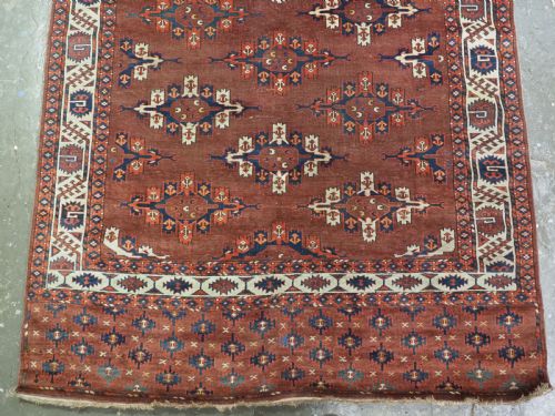 fig 3. ANTIQUE KARADASAHLI YOMUT SMALL MAIN CARPET WITH C-CENTRED KEPSE GULS, EARLY 19TH CENTURY.