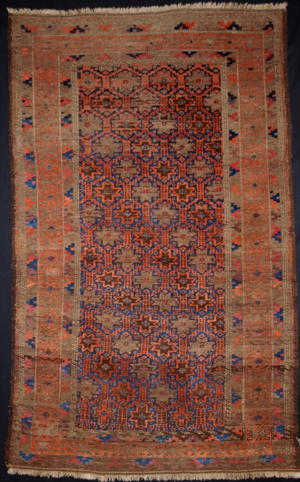 ANTIQUE BALUCH RUG, EIGHT POINTED STAR AND LATTICE DESIGN, CIRCA 1900