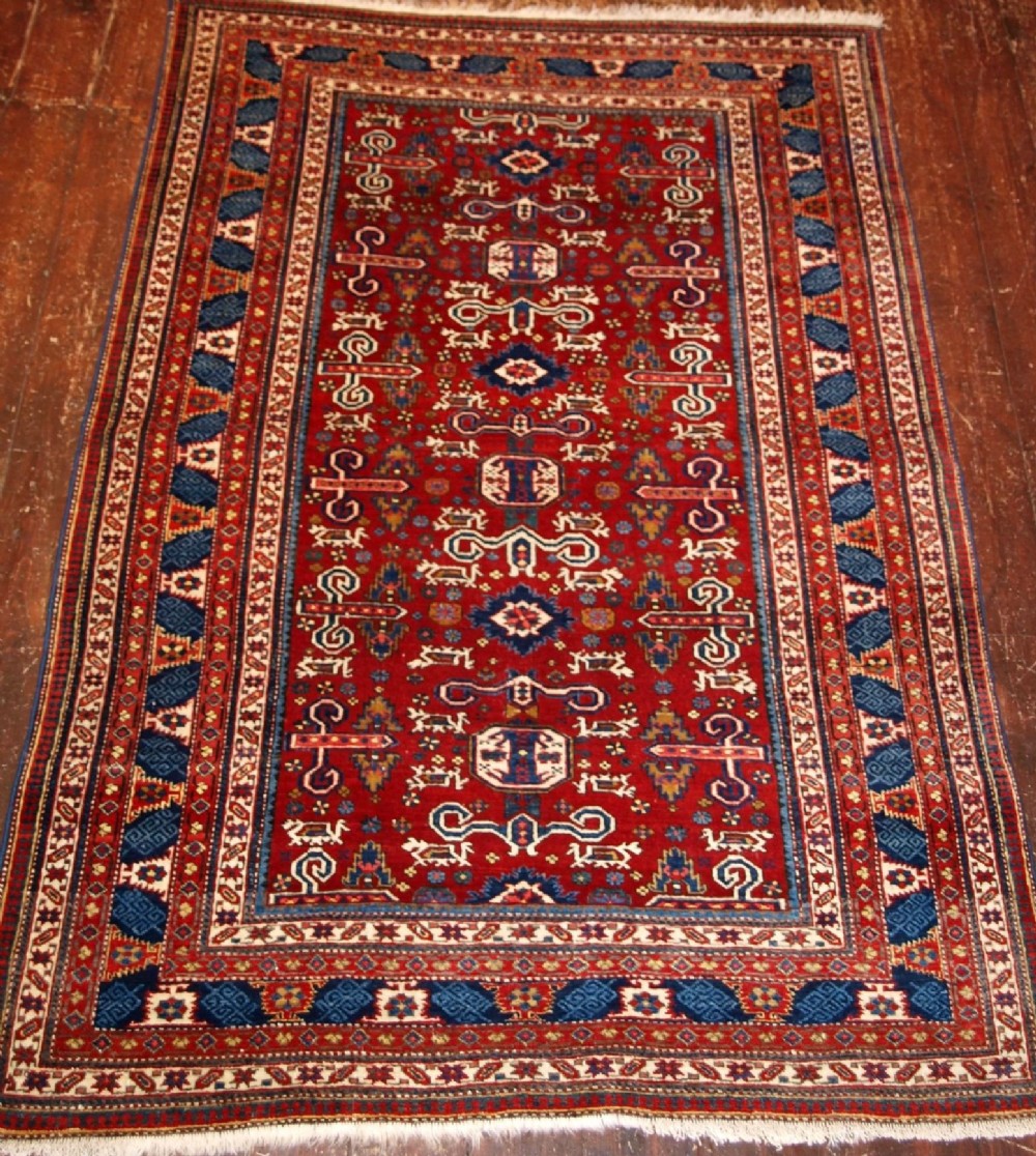 OLD CAUCASIAN KUBA REGION PEREPEDIL RUG, RED GROUND, CIRCA 1920