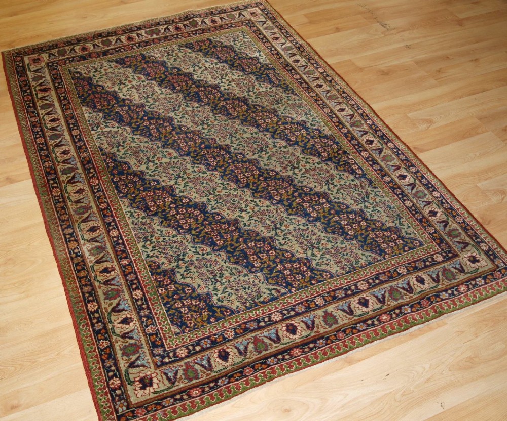 ANTIQUE TABRIZ RUG WITH UNUSUAL FLORAL STRIPE DESIGN, CIRCA 1900/20