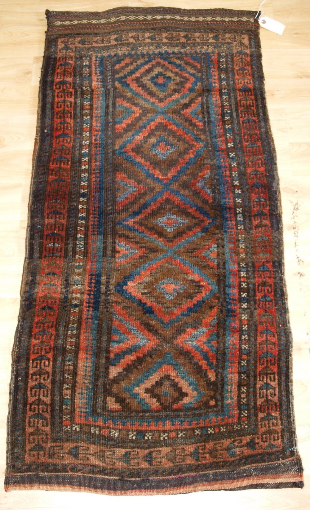ANTIQUE AFGHAN BALUCH GRAIN BAG ‘BALISHT’ WITH STRIPPED PLAIN WEAVE BACK, CIRCA 1900