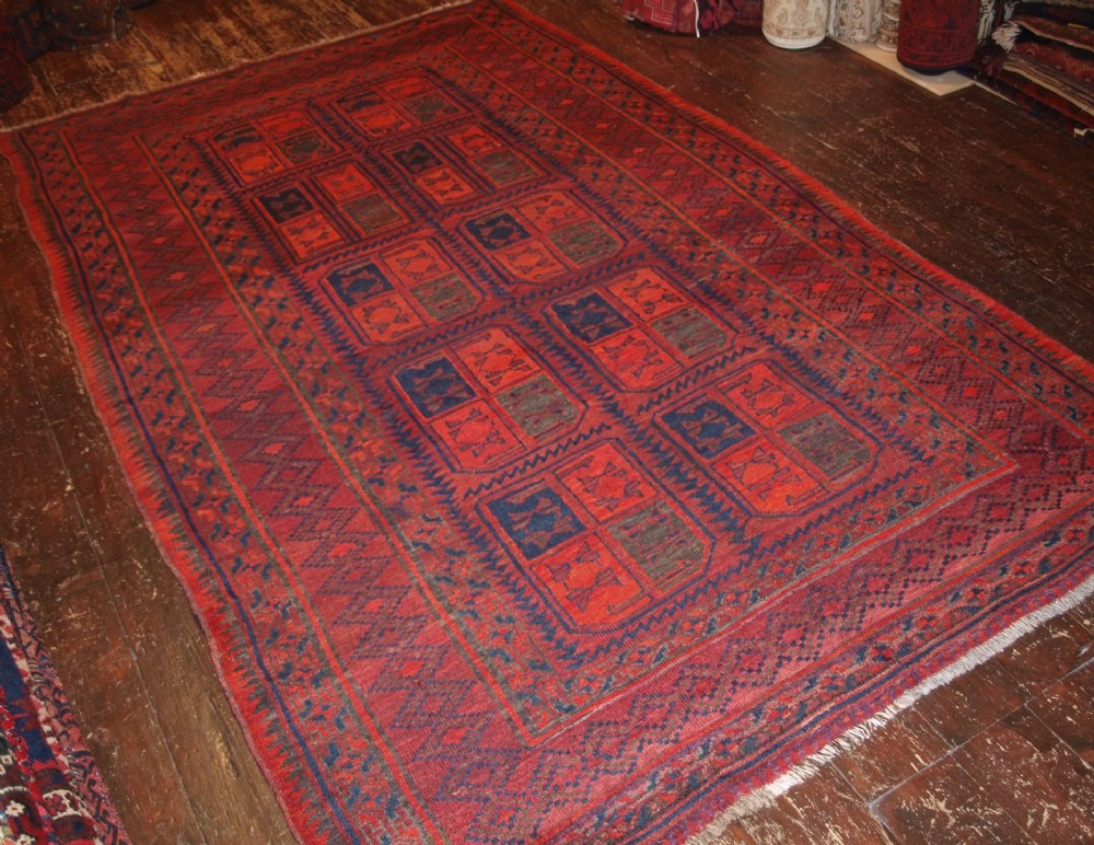 ANTIQUE AFGHAN RUG WITH TURKMEN INSPIRED DESIGN. CIRCA 1920