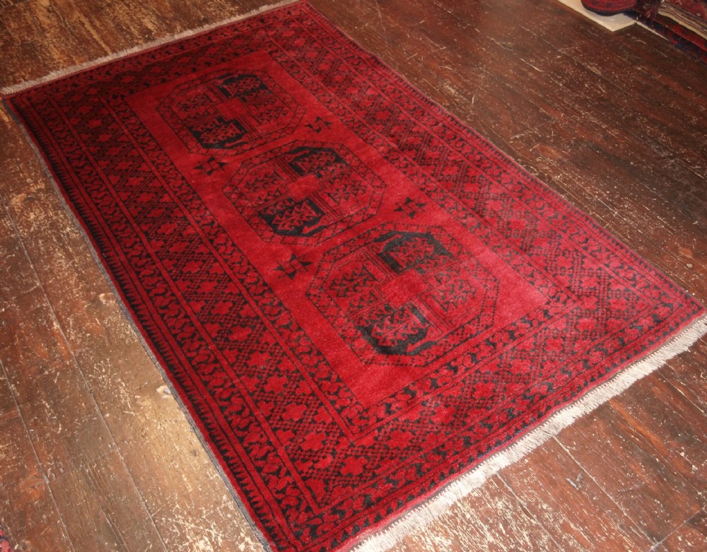 OLD AFGHAN RUG OF TRADITIONAL DESIGN, GREAT COLOUR, ABOUT 60 YEARS OLD