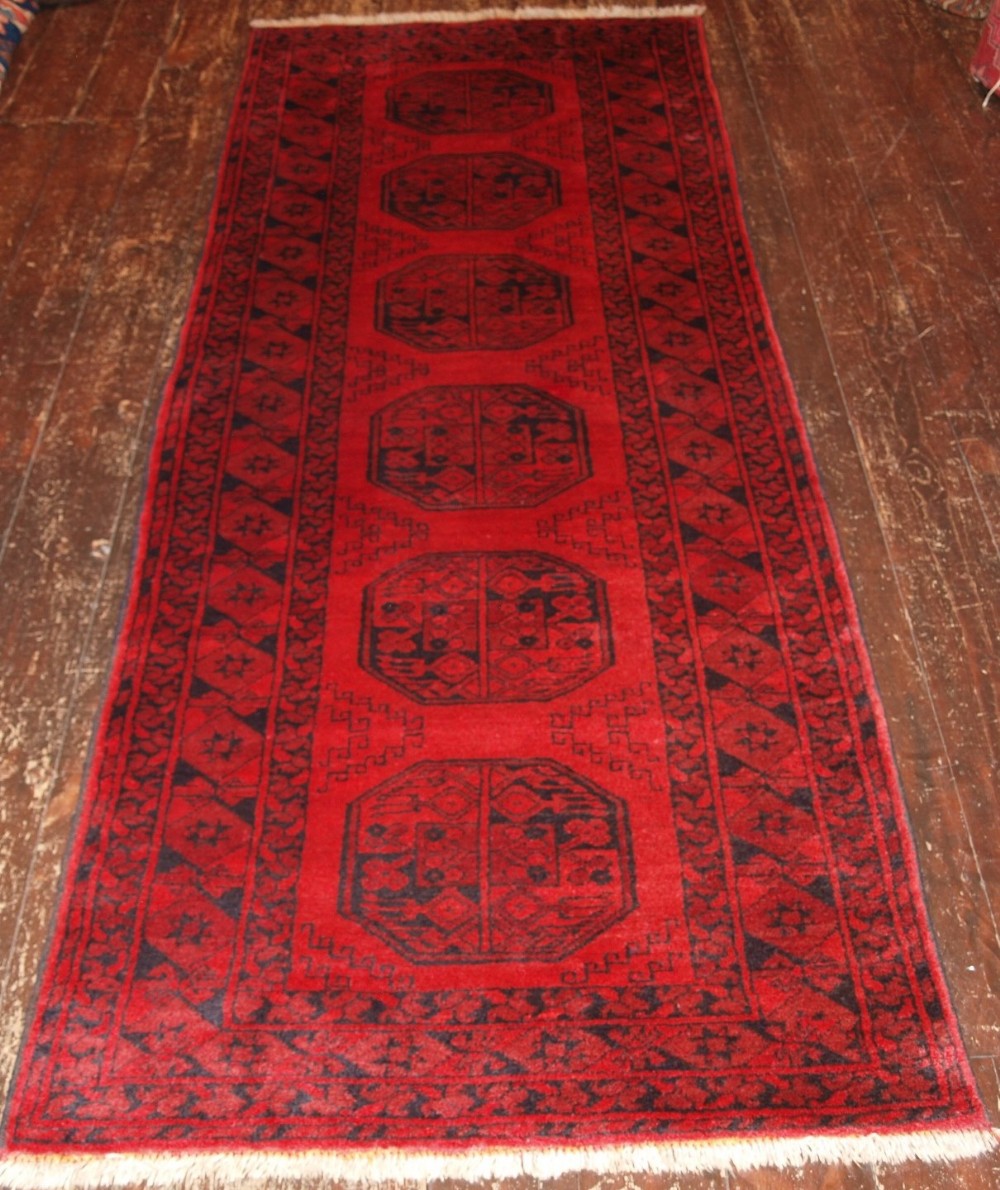 OLD AFGHAN RUNNER OF TRADITIONAL DESIGN, VERY HARD WEARING, ABOUT 60 YEARS OLD.