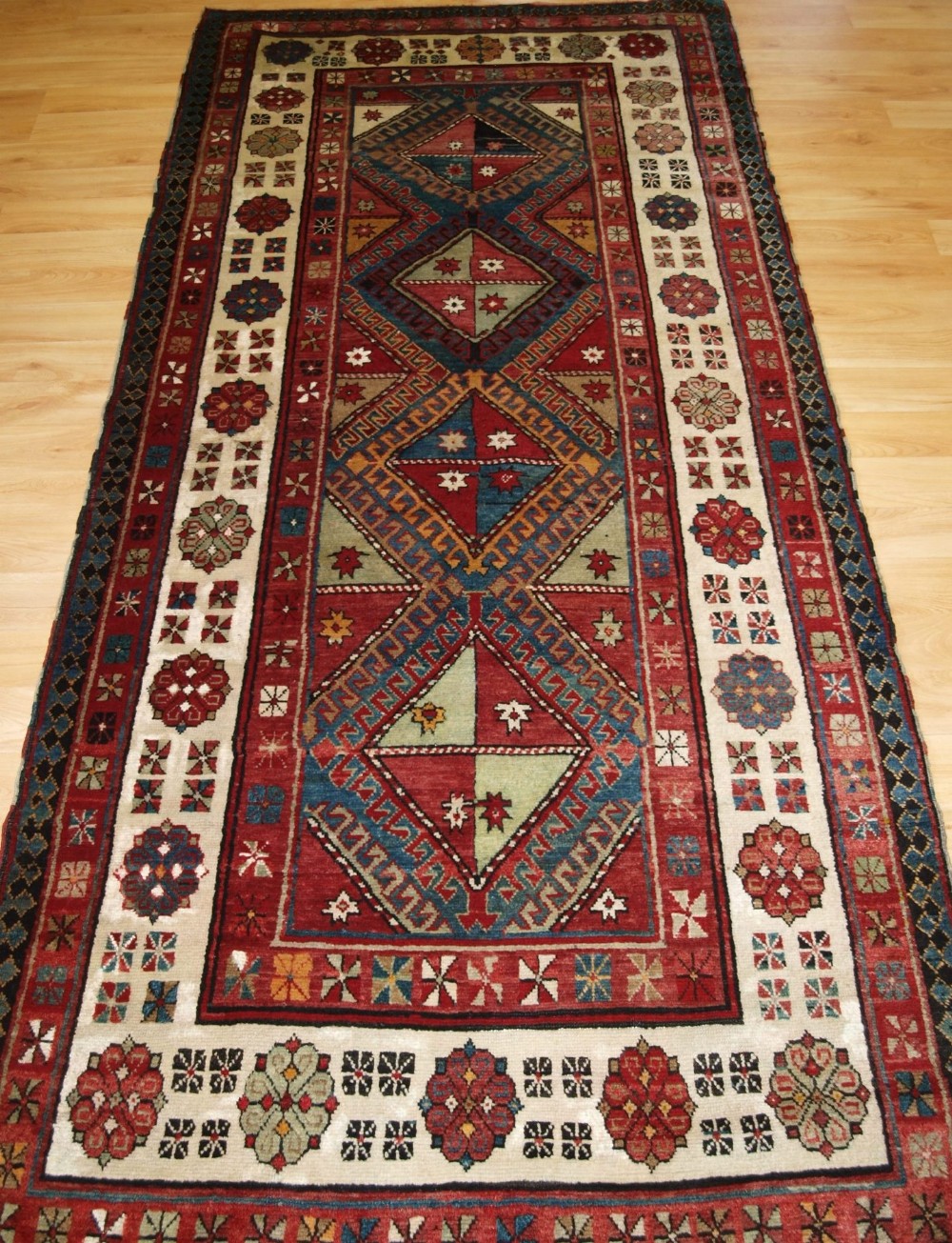OLD CAUCASIAN TALISH LONG RUG WITH FOUR MEDALLIONS, CIRCA 1920