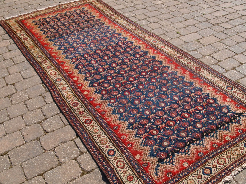 ANTIQUE KURDISH LONG RUG, SUPERB COLOUR AND GREAT DESIGN, CIRCA 1900.