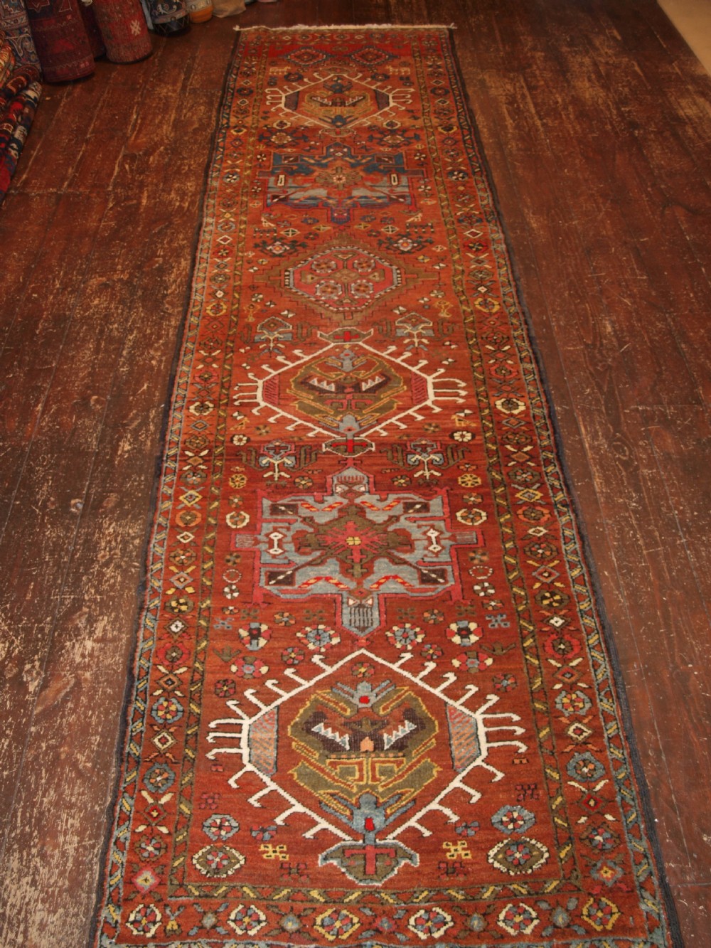 ANTIQUE NORTH WEST PERSIAN KARAJA RUNNER, HARD WEARING, SOFT COLOURS, CIRCA 1900.