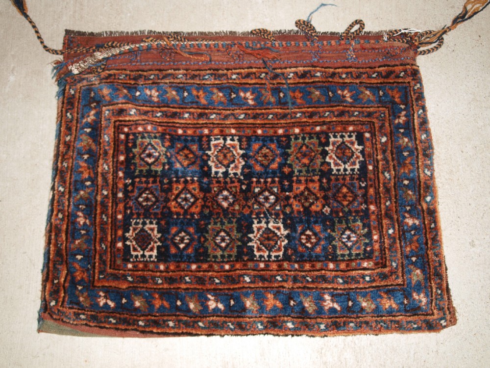 ANTIQUE SADDLE BAG WITH PLAIN WEAVE BACK, POSSIBLY AFSHAR, CIRCA 1900.