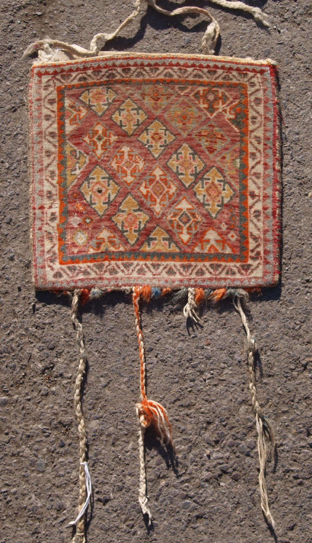 OLD SOUTH WEST PERSIAN QASHQAI CHANTEH WITH PLAIN WEAVE BACK AND TASSELS, CIRCA 1920.