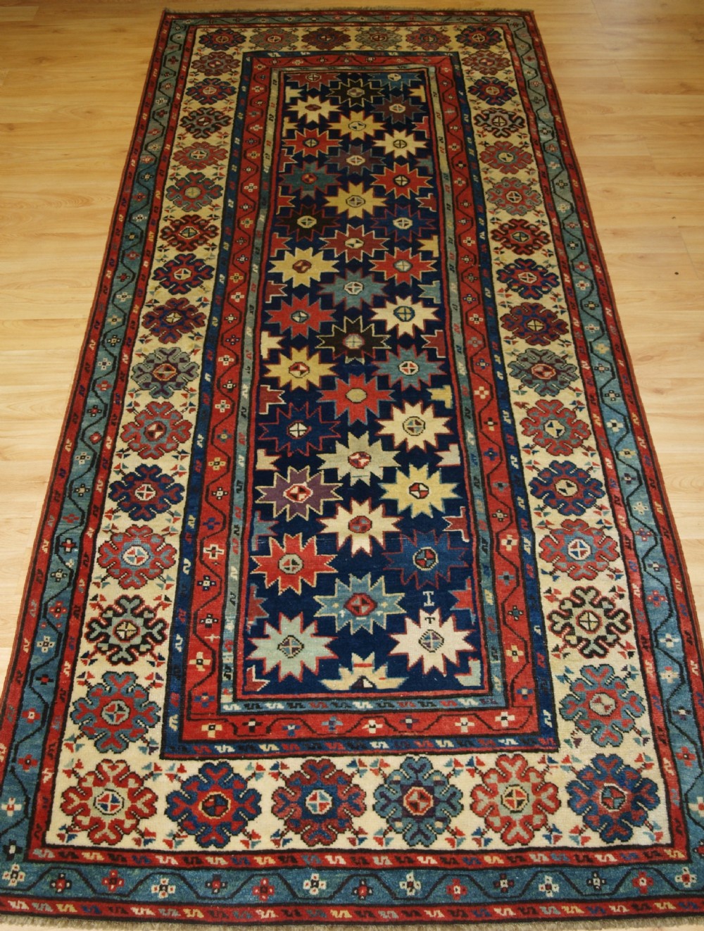 ANTIQUE CAUCASIAN TALISH LONG RUG WITH STAR DESIGN, SUPERB COLOURS, MID 19TH CENTURY.