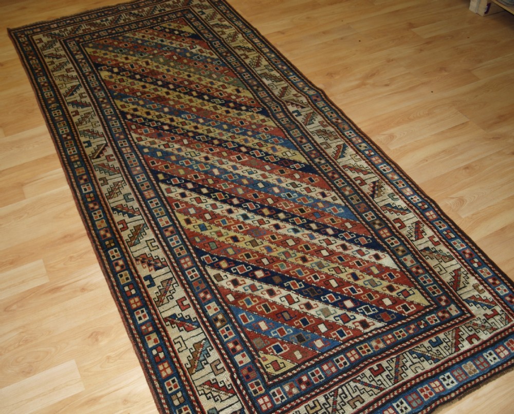 ANTIQUE CAUCASIAN GENDJE KAZAK LONG RUG WITH STRIPE DESIGN, SUPERB COLOURS, 2ND HALF 19TH CENTURY.
