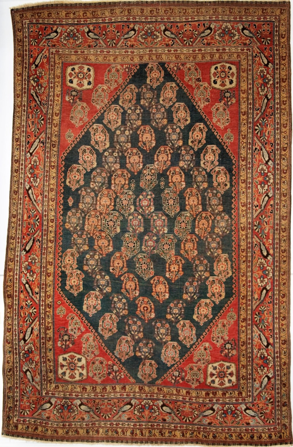 ANTIQUE SOUTH WEST PERSIAN QASHQAI KASHKULI RUG, BOTEH DESIGN ON RARE GREEN GROUND, CIRCA 1880.