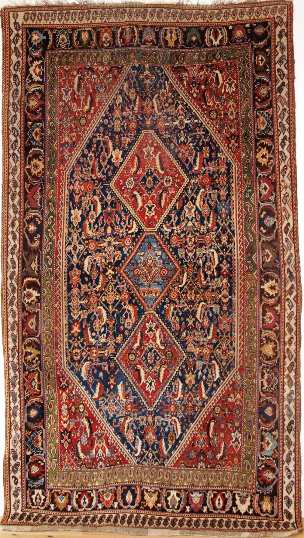 ANTIQUE SOUTH WEST PERSIAN QASHQAI KASHKULI RUG WITH TRIPLE MEDALLION DESIGN, CIRCA 1880.