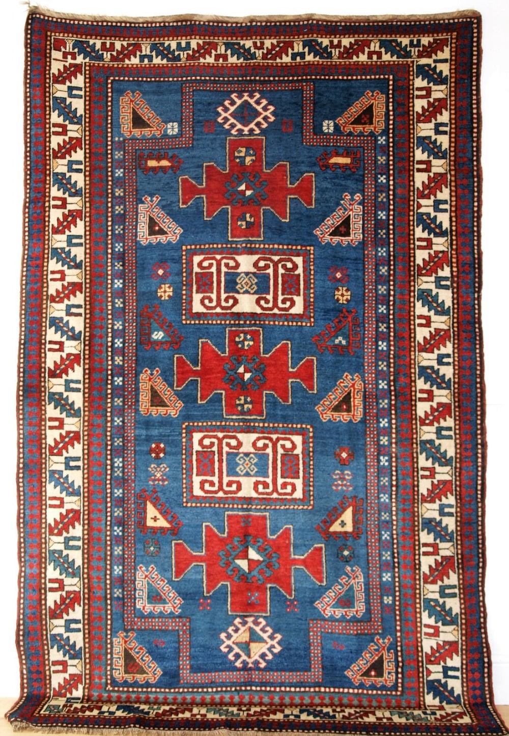 ANTIQUE CAUCASIAN KARACHOP KAZAK WITH BLUE GROUND, OUTSTANDING COLOUR, CIRCA 1890.