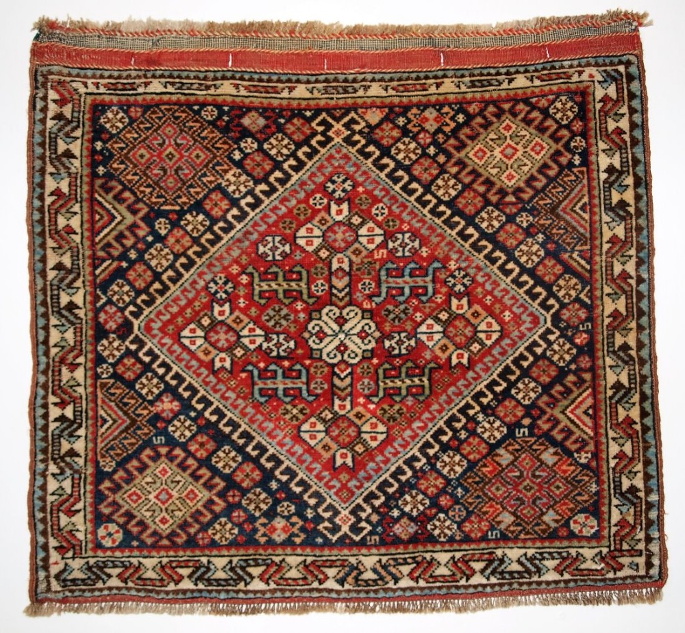 ANTIQUE QASHQAI BAG FACE, TRADITIONAL TRIBAL DESIGN, CIRCA 1900.