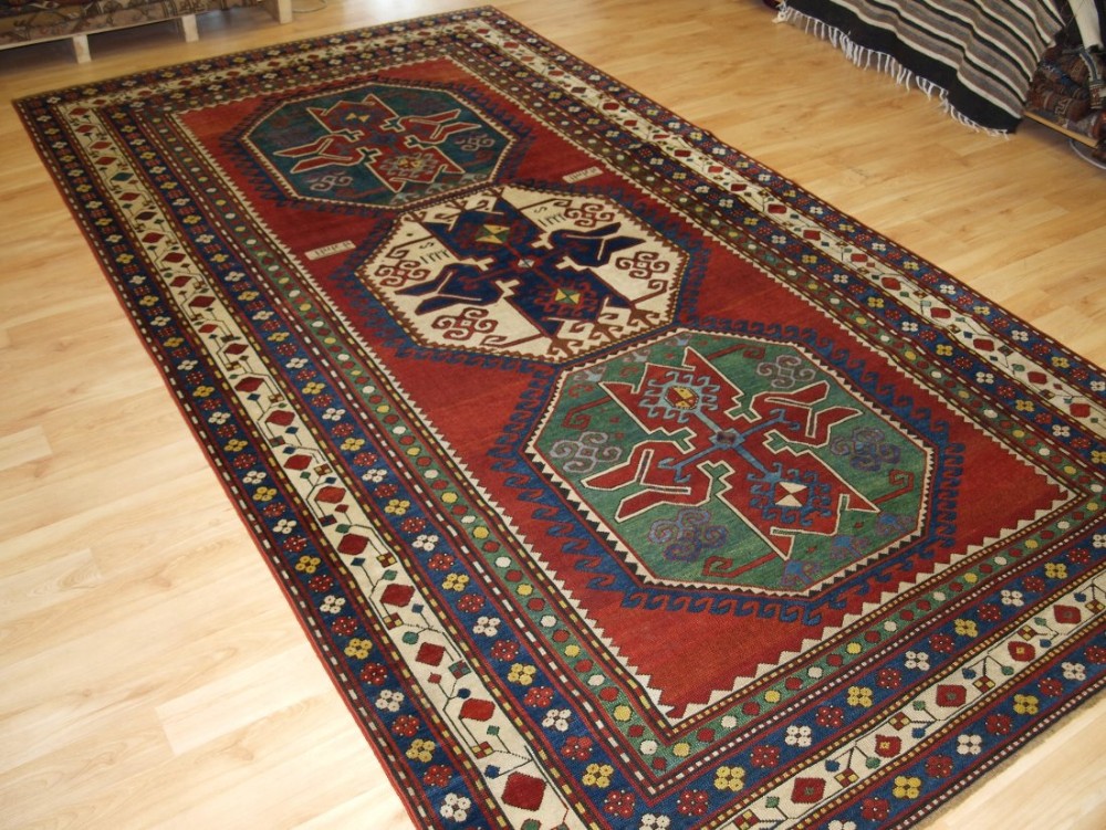 ANTIQUE CAUCASIAN LORI PAMBAK RUG, DATED, OUTSTANDING COLOURS, BOLD DESIGN, CIRCA 1900.