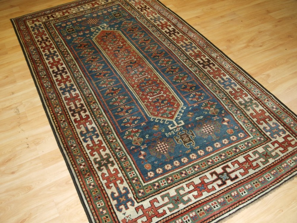 ANTIQUE SOUTH CAUCASIAN KAZAK RUG, VERY SOFT COLOURS, CIRCA 1900.