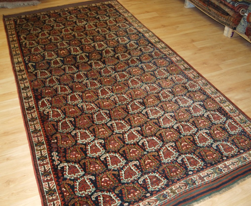 ANTIQUE PERSIAN KURDISH OR AFSHAR RUG OF LARGE SIZE WITH ALL OVER BOTEH DESIGN, CIRCA 1900