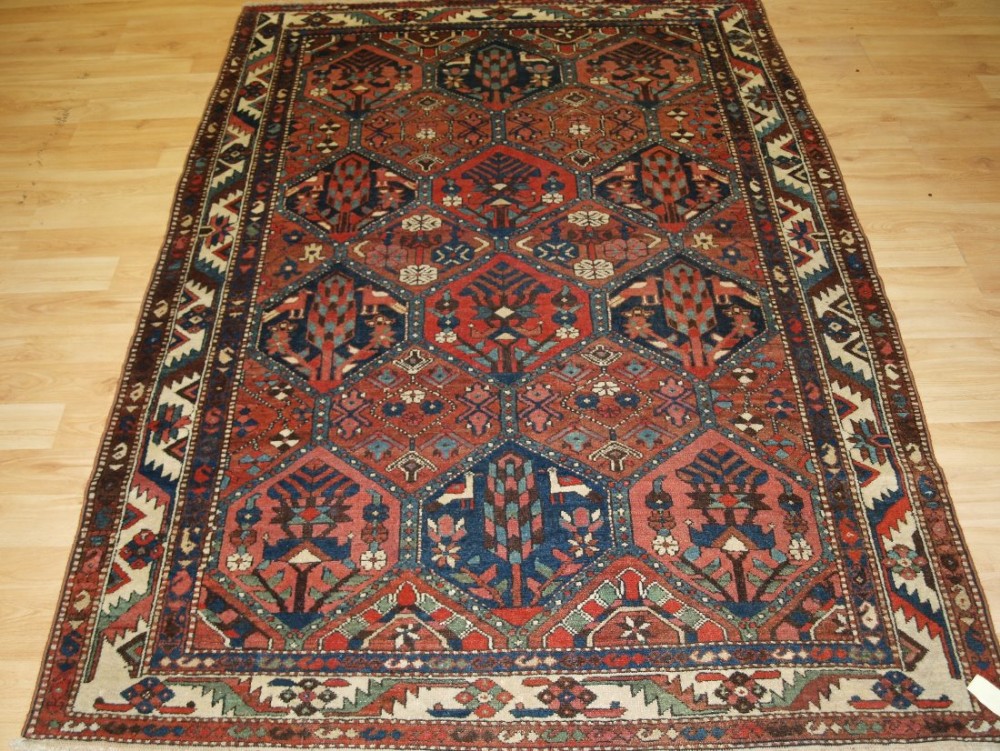 ANTIQUE CENTRAL PERSIAN BAKHTIARI RUG, GARDEN DESIGN WITH TREES AND BIRDS, CIRCA 1900/20.