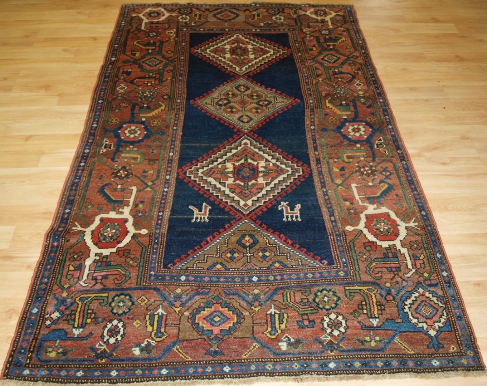 ANTIQUE NORTH WEST PERSIAN KURDISH RUG WITH SUPERB LARGE BORDER, CIRCA 1900.