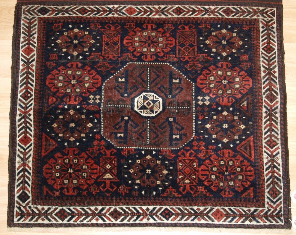 ANTIQUE BALUCH SADDLE BAG, STAR AND OCTAGON DESIGN, COMPLETE WITH BACK CIRCA 1880. (1 OF A PAIR).