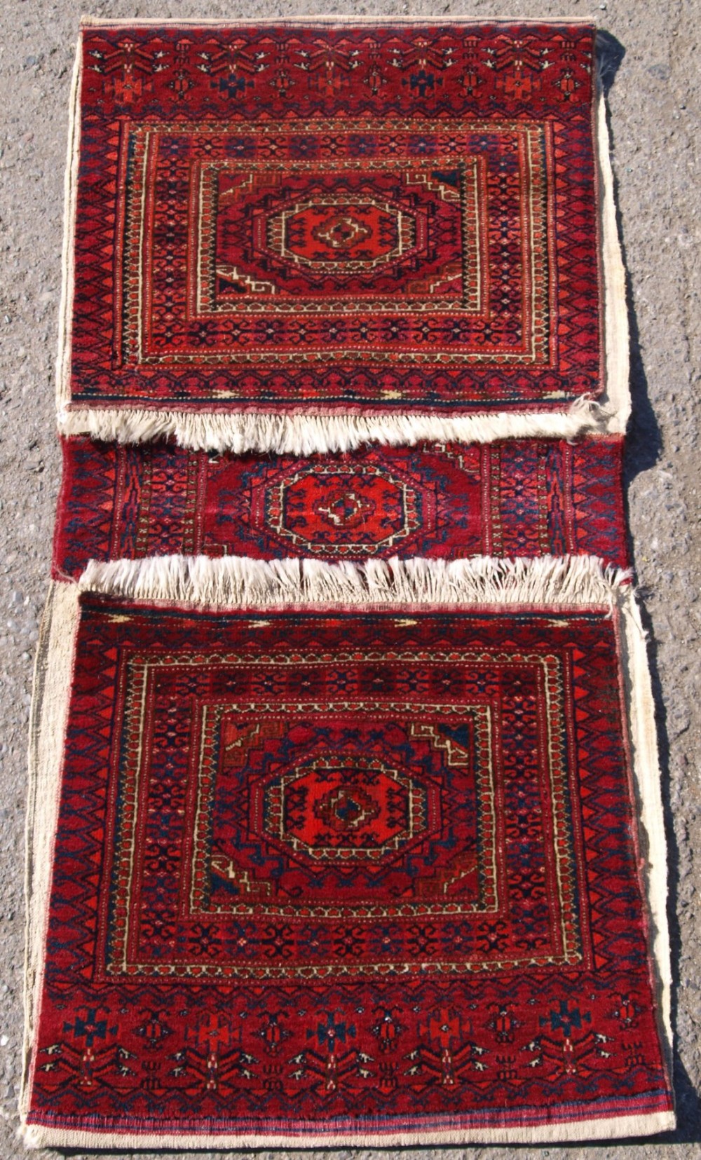 ANTIQUE TEKKE TURKMEN SADDLE BAGS WITH SALOR GUL DESIGN, CIRCA 1900.