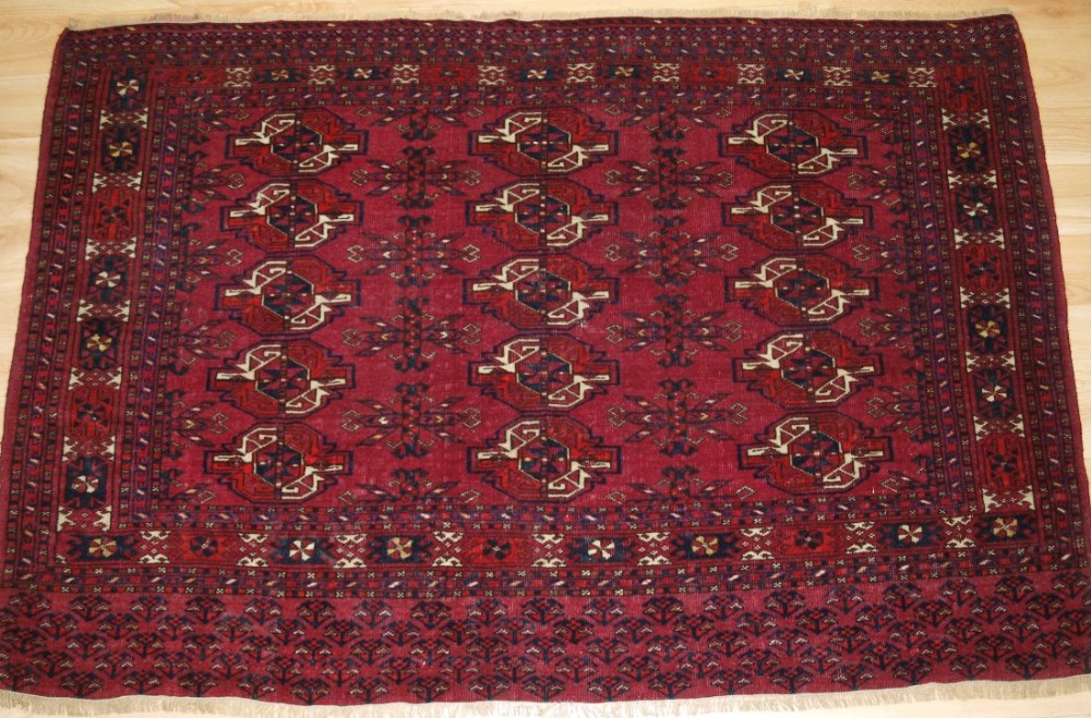 ANTIQUE ERSARI TURKMEN CHUVAL WITH 15 GUL DESIGN, SOFT COLOURS, CIRCA 1900.