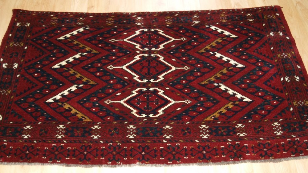ANTIQUE ERSARI BESHIR TURKMEN CHUVAL WITH IKAT DESIGN, FULL PILE, CIRCA 1900.