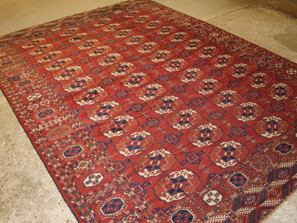 ANTIQUE TEKKE TURKMEN MAIN CARPET WITH SUPERB COLOUR AND CONDITION, LARGE GULS, CIRCA 1870.