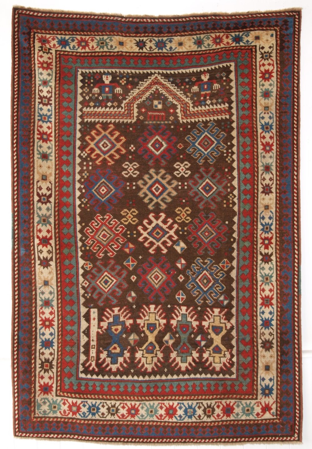 ANTIQUE CAUCASIAN KARABAGH REGION PRAYER RUG, HUMAN FIGURES, CIRCA 1880.