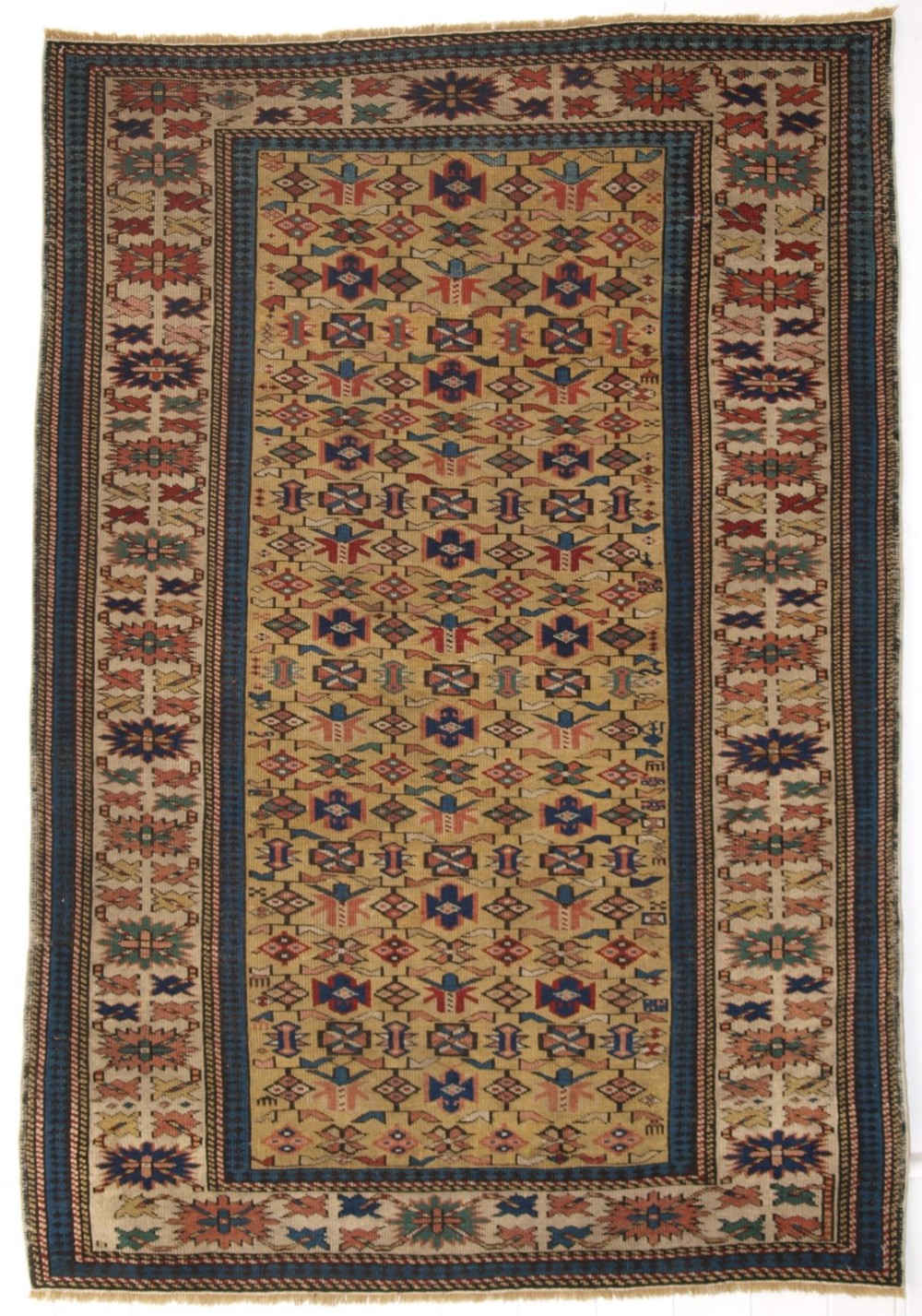 ANTIQUE CAUCASIAN KUBA RUG WITH YELLOW GROUND, VERY FINE WEAVE, CIRCA 1880.