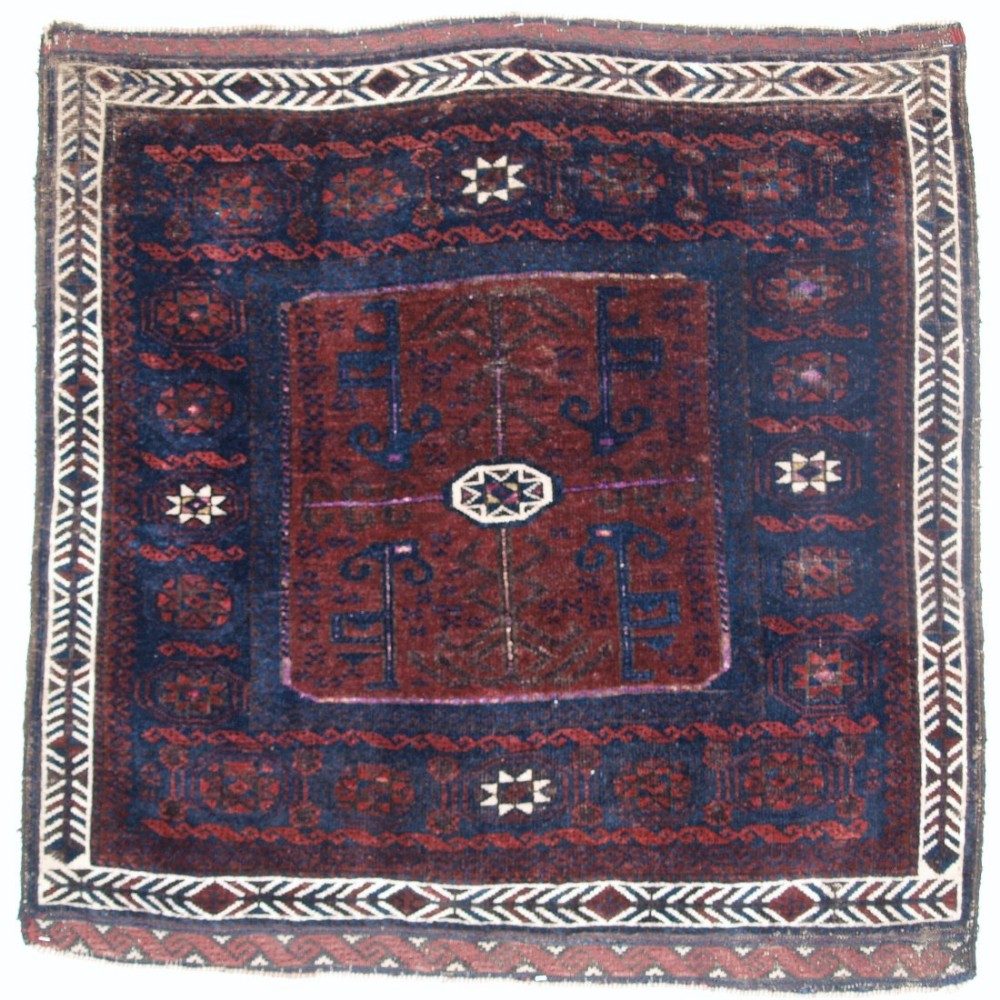 ANTIQUE BALUCH SADDLE BAG FACE, 'STAR IN OCTAGON DESIGN', SILK HIGHLIGHTS THROUGHOUT, CIRCA 1880.