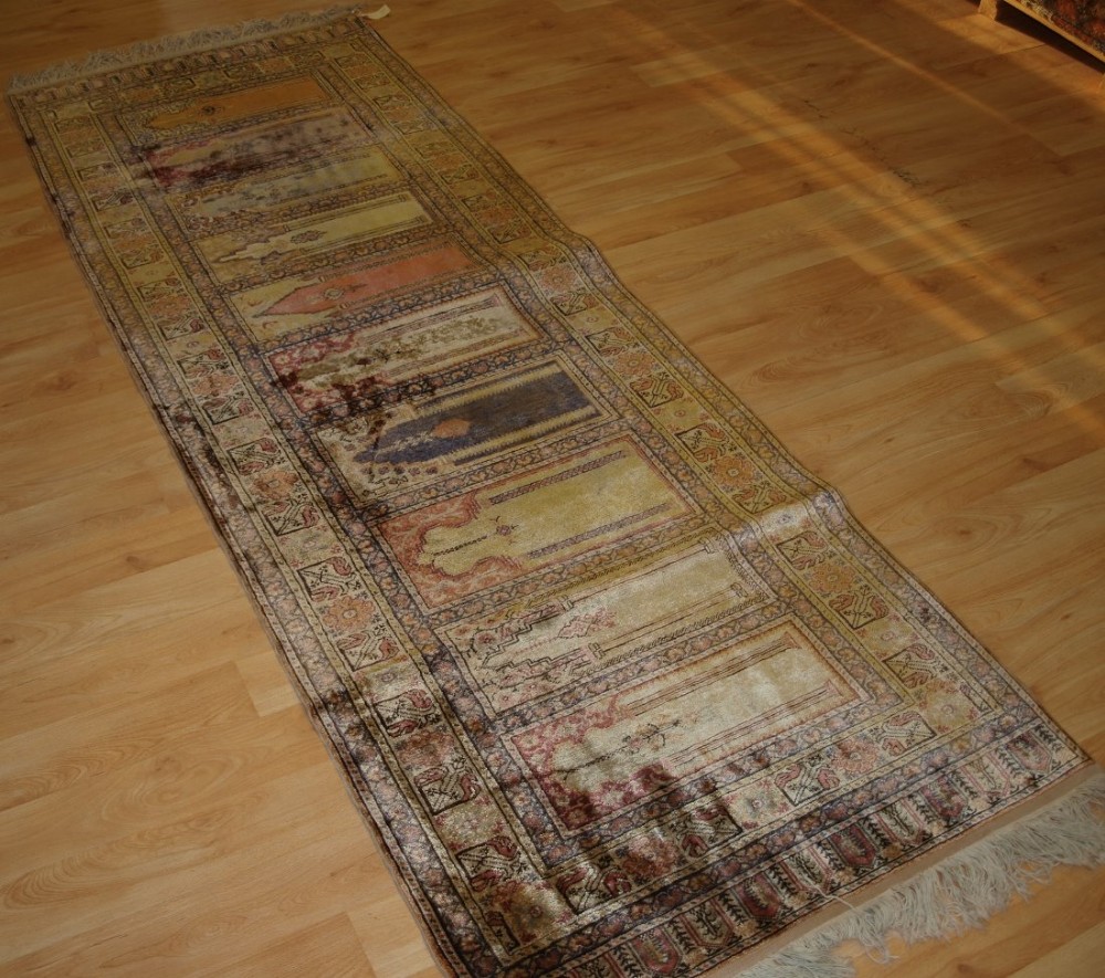 OLD TURKISH KAYSERI 'ART SILK' RUG, PRAYER SAF DESIGN, RUNNER, CIRCA 1920.