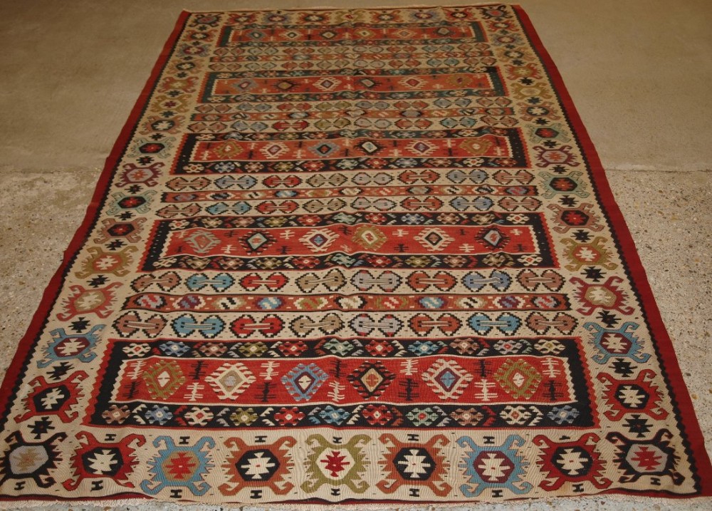 OLD TURKISH SARKOY KILIM RUG, IVORY BORDER, BANDED DESIGN, SUPERB COLOURS, CIRCA 1920.