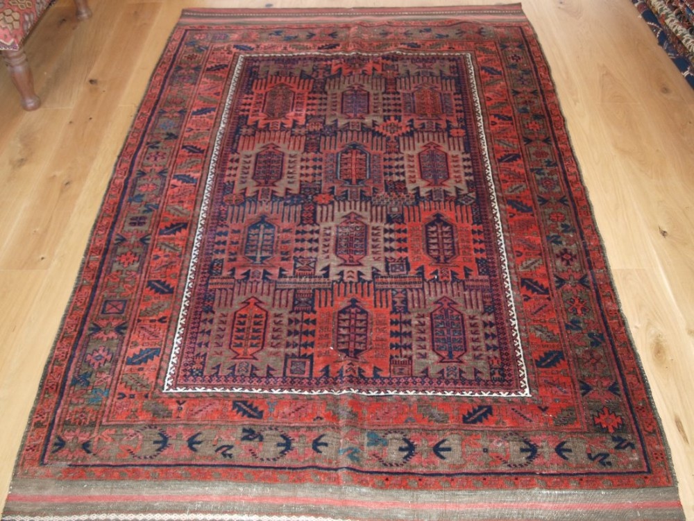 ANTIQUE TIMURI BALUCH MAIN CARPET, CLASSIC DESIGN, CORRODED BROWNS, CIRCA 1900.