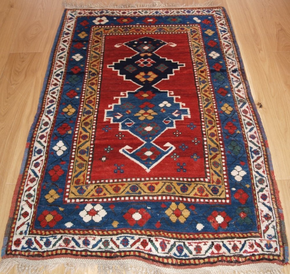 ANTIQUE CAUCASIAN KAZAK RUG WITH SUPERB COLOUR AND LONG GLOSSY PILE, LATE 19TH CENTURY.