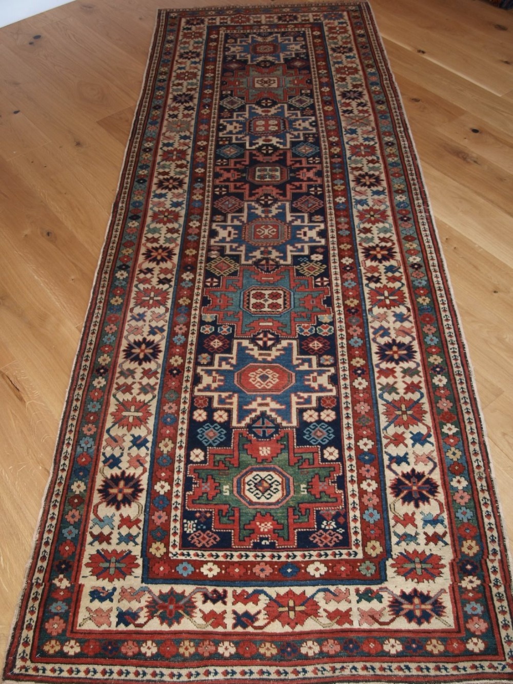 ANTIQUE CAUCASIAN SHIRVAN RUNNER WITH LESGHI STAR DESIGN, FINE WEAVE, SUPERB COLOURS. CIRCA 1880.