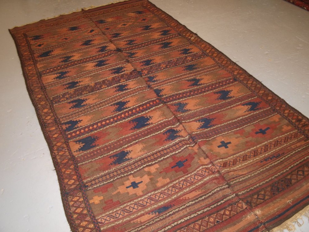 ANTIQUE AFGHAN BALUCH TWO PART KILIM, FLAT WEAVE AND WEFT WORK, CIRCA 1900.