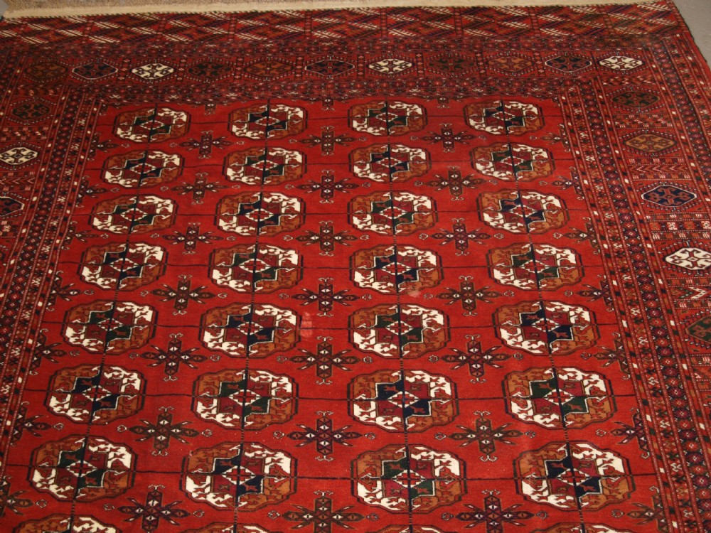 ANTIQUE TEKKE TURKMEN MAIN CARPET, FULL PILE, SOFT WOOL, CIRCA 1900. View II
