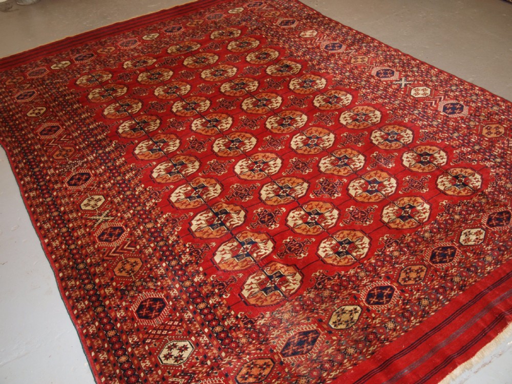 ANTIQUE TEKKE TURKMEN MAIN CARPET, UNUSUAL PILED ELEM END PANELS, 4TH QUARTER 19TH CENTURY.