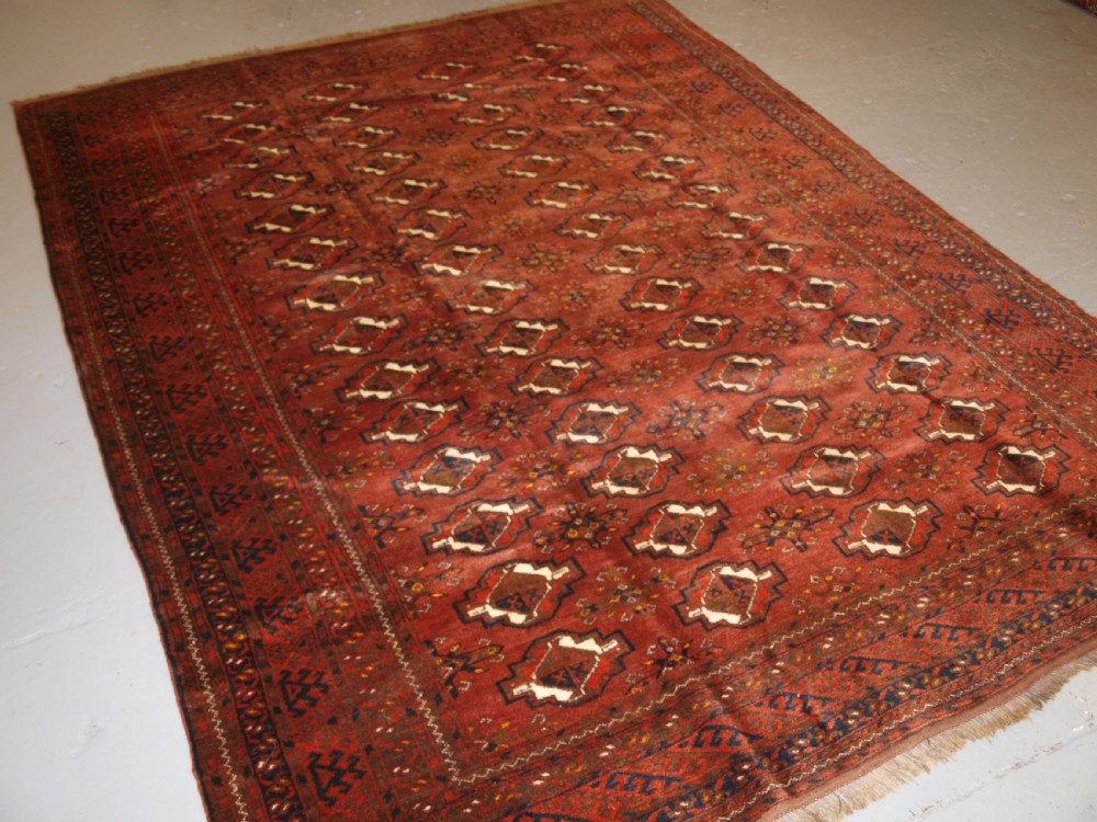 OLD AFGHAN VILLAGE CARPET, ERSARI WEAVERS, CHUVAL GUL DESIGN, CIRCA 1920.