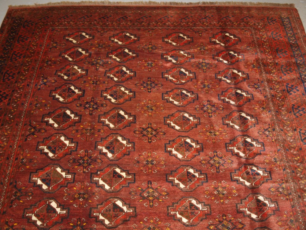 OLD AFGHAN VILLAGE CARPET, ERSARI WEAVERS, CHUVAL GUL DESIGN, CIRCA 1920. View V